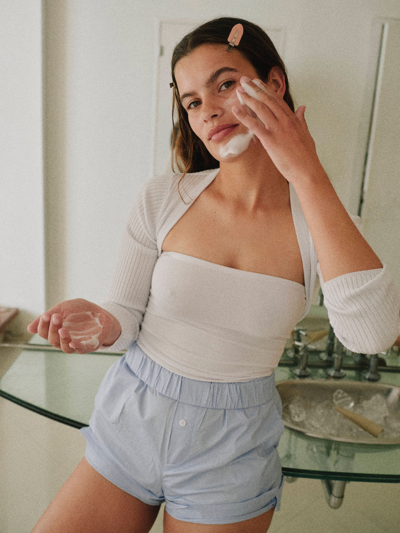 Applying skincare product, close up